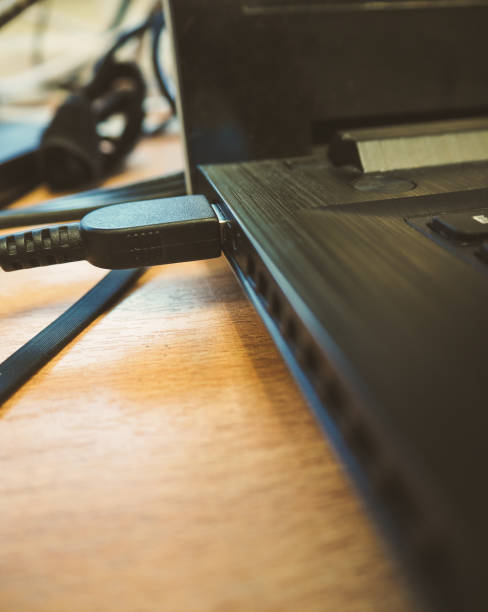istock Close up into plugged power on laptop 862541374