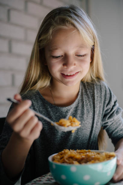 istock Girl eating cereals for breakfast 862542694