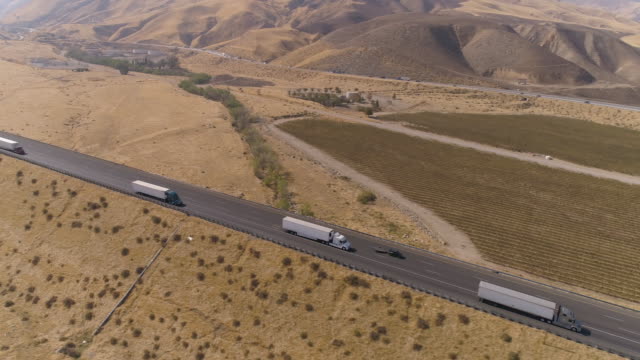 Aerial semi truck driving on the road