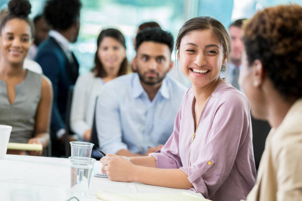 istock Smiling Hispanic business student visits with fellow student before class 862545718