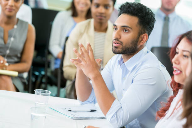 istock Young male business student listens to presentation 862545746