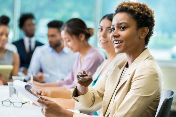 istock Young female business student recognizes new speaker during class 862545776