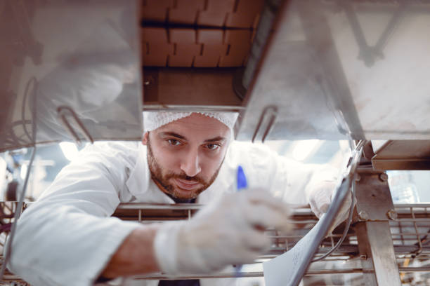 istock Scientist with Clipboard Working on Production Line 862546070