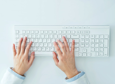 Businesswoman hands typing on the keyboard