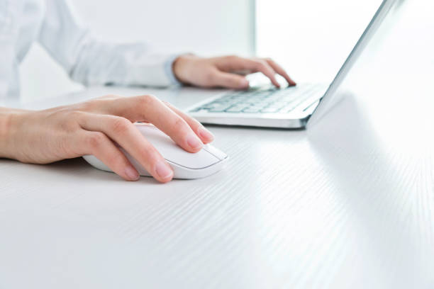 istock Businesswoman hands on a mouse and keyboard 862552070