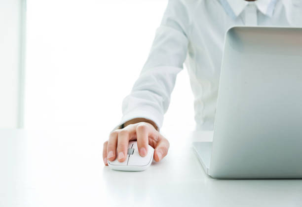 Businesswoman hands on a mouse and keyboard