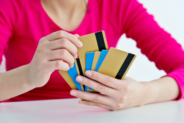 Woman hand holding stack of credit cards