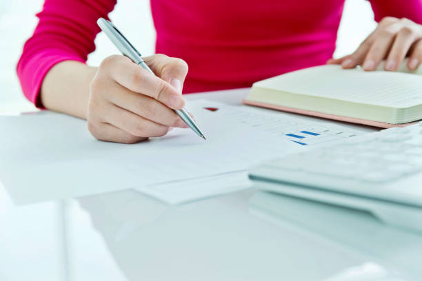 istock Woman hand writing in a paper 862553422
