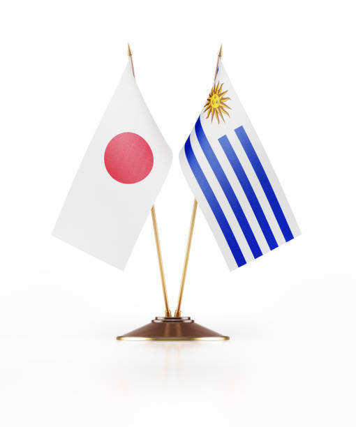 istock Miniature Flags Of Japan and Uruguay On White Background 862556166