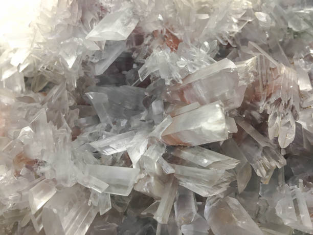 istock White Quartz Crystal cluster on black background. It's selective focus 862556230