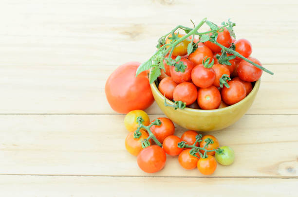 istock cherry tomatos vegetable in bowl on wooden table backgrounds 862556834