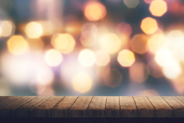 istock Wooden board and colorful blurred light 862557630