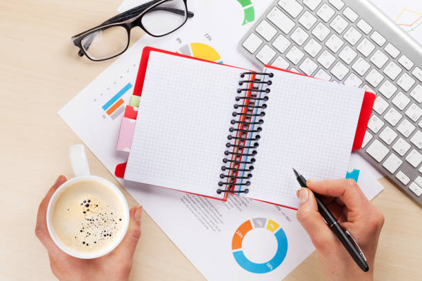 istock Woman working with reports and charts 862560174