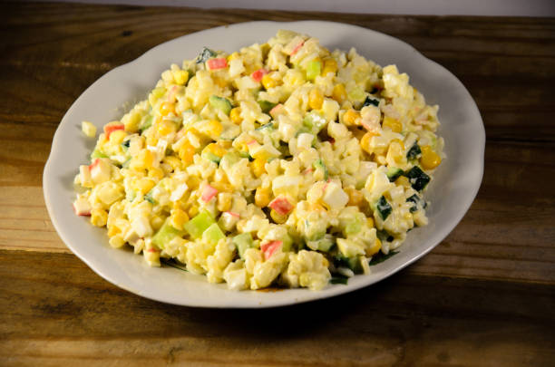 istock Salad with crab sticks, corn, cucumber, and eggs 862560572