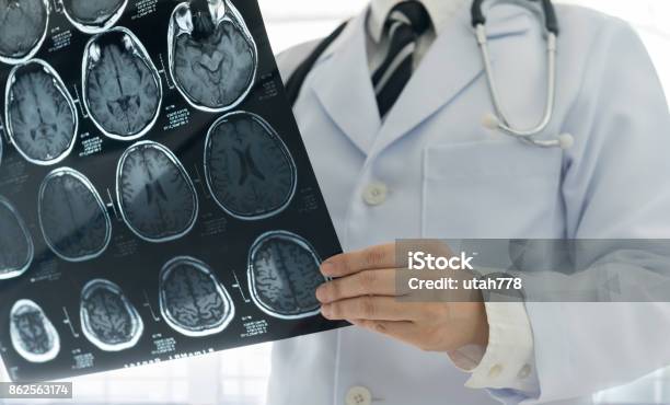 Doctor Brain Mri Stock Photo - Download Image Now - Stroke - Illness, MRI Scan, Neurologist
