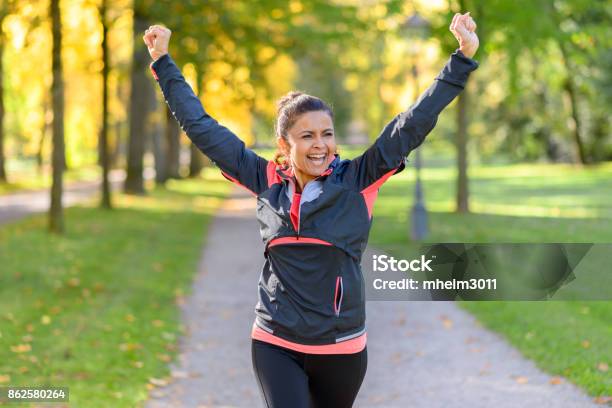Happy Fit Woman Cheering And Celebrating Stock Photo - Download Image Now - Exercising, Women, Relaxation Exercise