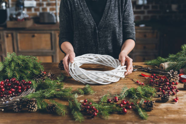 istock florist with Christmas wreath 862582528