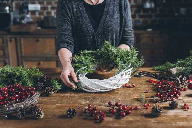 istock florist making Christmas wreath 862582662