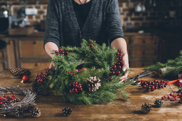istock florist with Christmas fir wreath 862582822