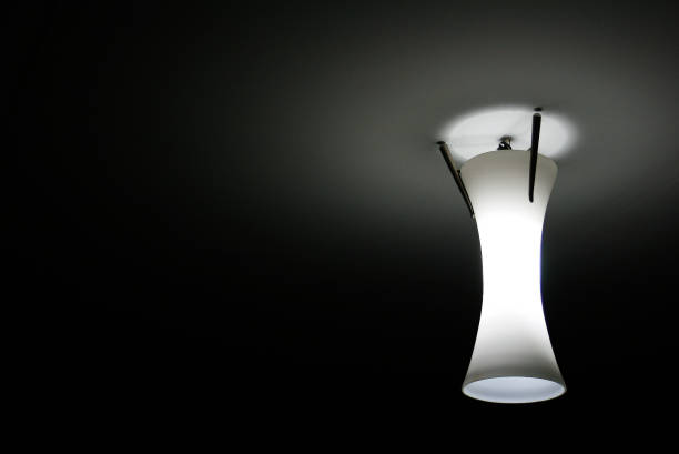 istock Cylinder lamps on the ceiling and shadows 862585570