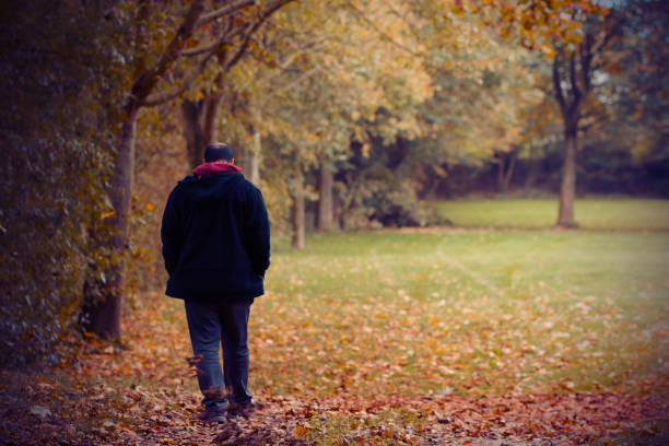 istock A Man Taking A Peaceful Walk In The Park One Autumn Afternoon 862590694