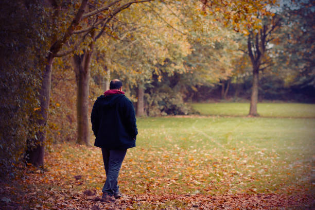 istock A Man Taking A Peaceful Walk In The Park One Autumn Afternoon 862590704