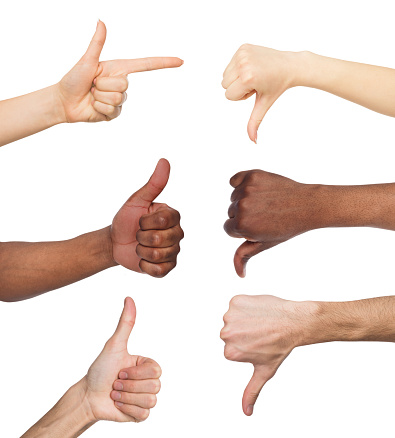 Black and white hands gesturing at white isolated background. Multiethnic hands showing like and dislike, set of finger symbols