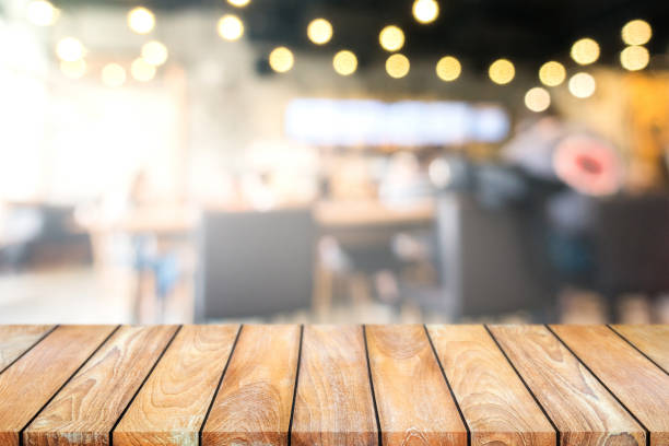 istock Empty wooden table and Blur coffee shop or cafe restaurant for product placement. 862600404