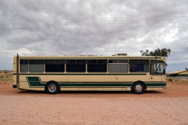 An (ex) school bus used for traveling by a family in Coober Pedy, Central Australia stock photo