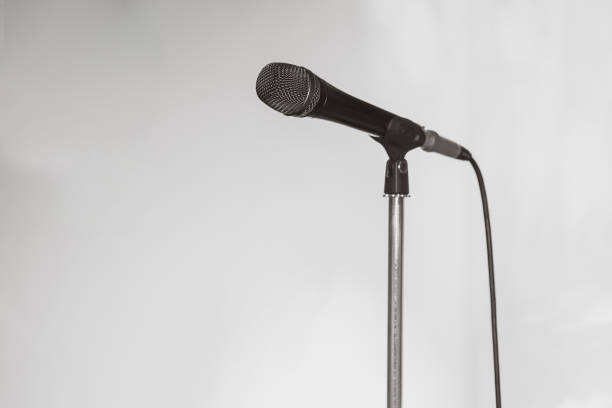 istock Microphone. Black and white photo. Microphone on stage. Microphone close-up. A pub. Bar. A restaurant. Classical music. Music 862601390