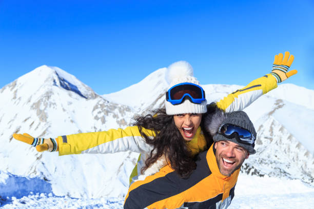 istock Young couple skiers having fun on top snow mountain 862605040