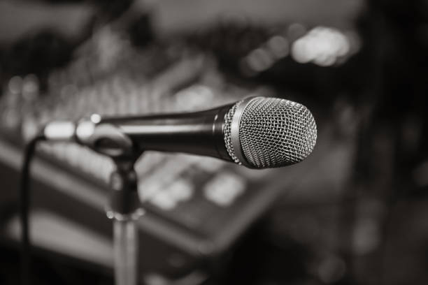 istock Microphone. Black and white photo. Microphone on stage. Microphone close-up. 862605110