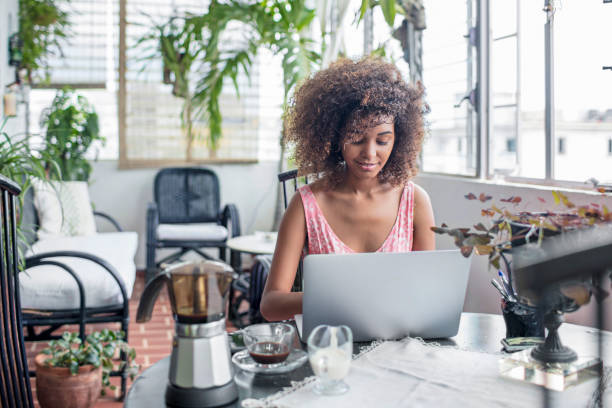 istock Beautiful young woman using laptop at home 862605290