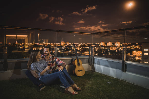 istock Romantic moment on a penthouse terrace by night! 862608748