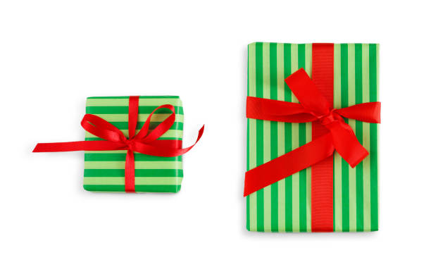istock Gift box wrapped in striped paper and red ribbon 862609048