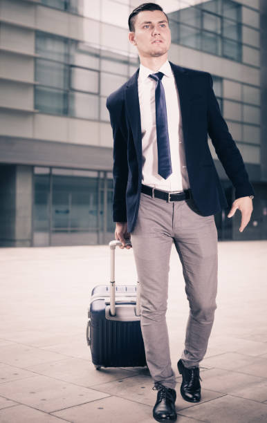 istock Adult man in suit with suitcase is staying 862612612