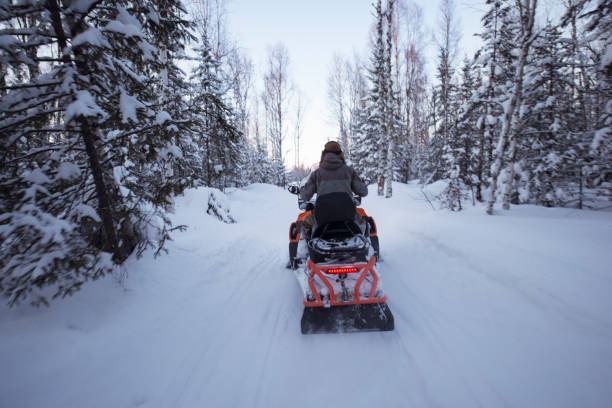 istock Snowmobile driver riding in Taga forest. 862616512