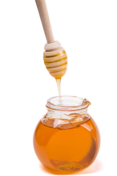 istock Jar Of Honey With Honey Dipper 862621058