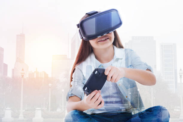 istock Smiling girl squatting cross-legged and playing video game 862622624