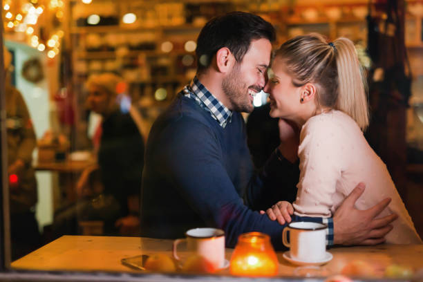 istock Young attractive couple on date in bar 862622662
