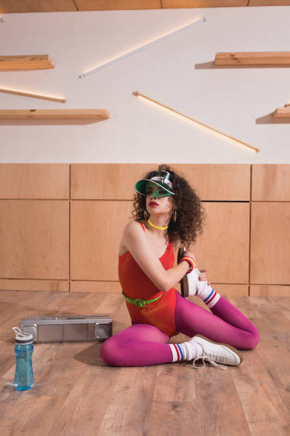 istock beautiful woman stretching on floor 862624772