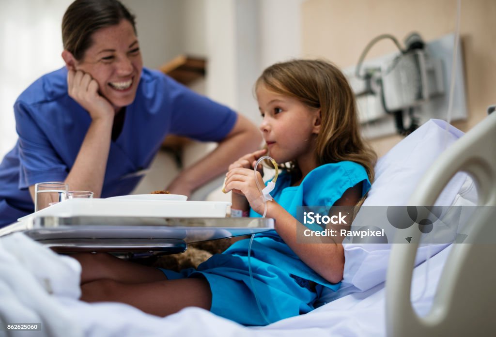 Young Caucasian girl is staying at the hospital Hospital Stock Photo