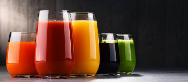 Glasses with fresh organic vegetable and fruit juices