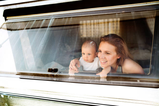 istock Mother and baby son in a camper van. 862629186