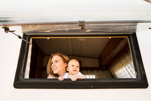 istock Mother and baby son in a camper van. 862629232
