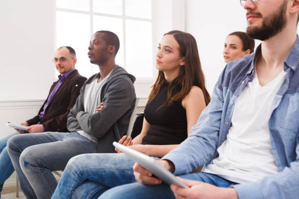 istock Group of people sitting at seminar, copy space 862629432