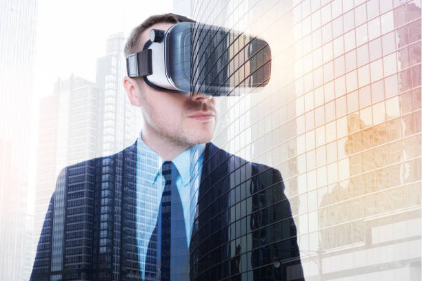 istock Handsome man in VR headset posing on urban background 862629968
