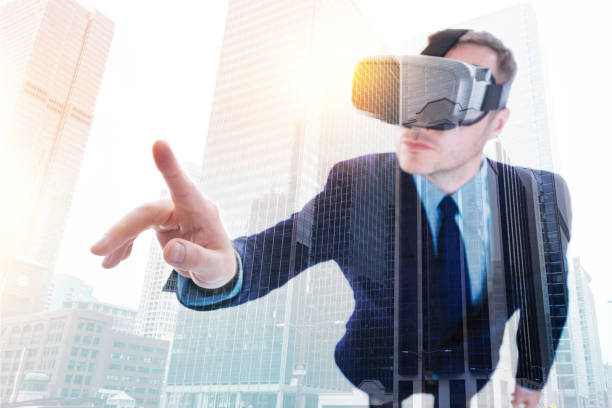 istock Businessman in VR headset ready to touch something with finger 862630726