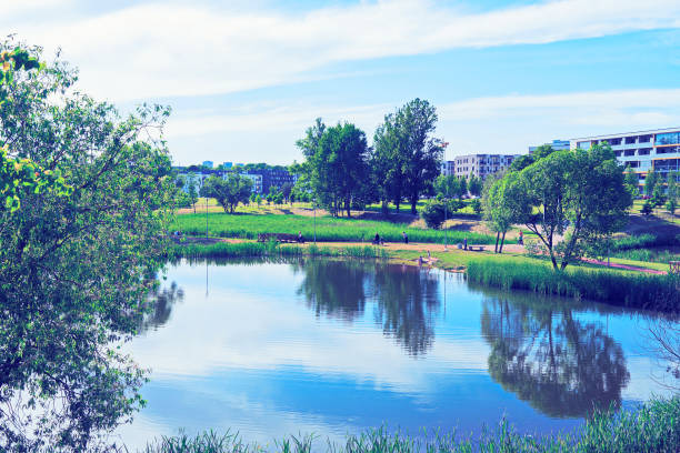 istock Landscape with park and pond and modern apartment buildings 862632702