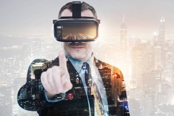 istock Pleasant businessman wearing VR headset and pointing at camera 862633222